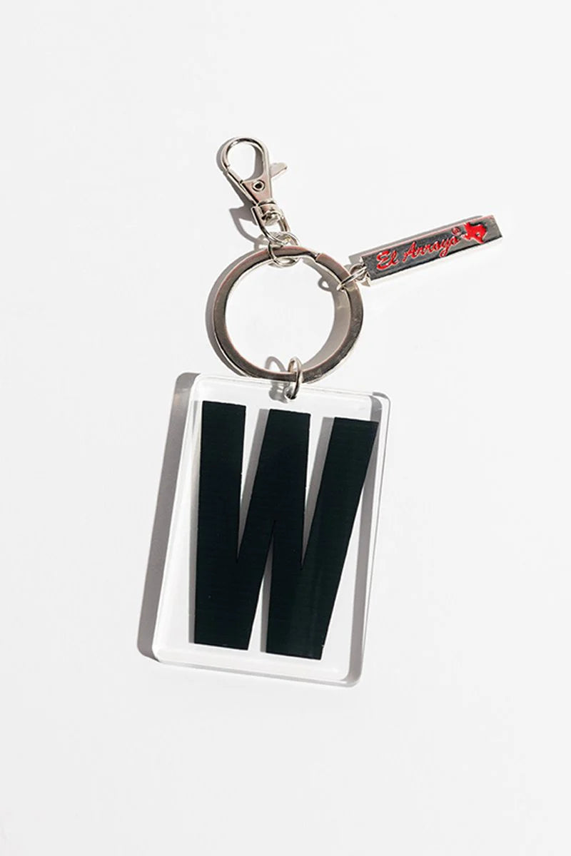 Clear acrylic keychain with bold black "W," silver clasp, keyring, and small red-detailed tag. Sizes available: one size.