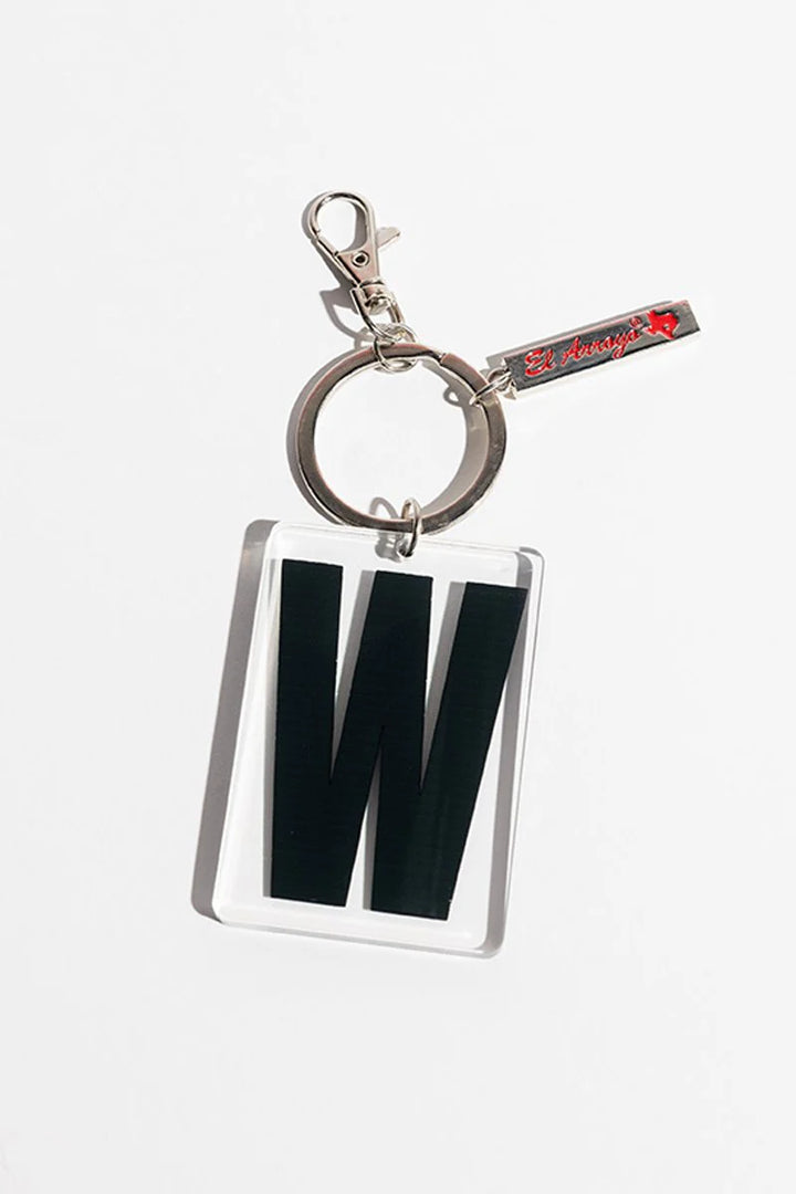 Clear acrylic keychain with bold black "W," silver clasp, keyring, and small red-detailed tag. Sizes available: one size.