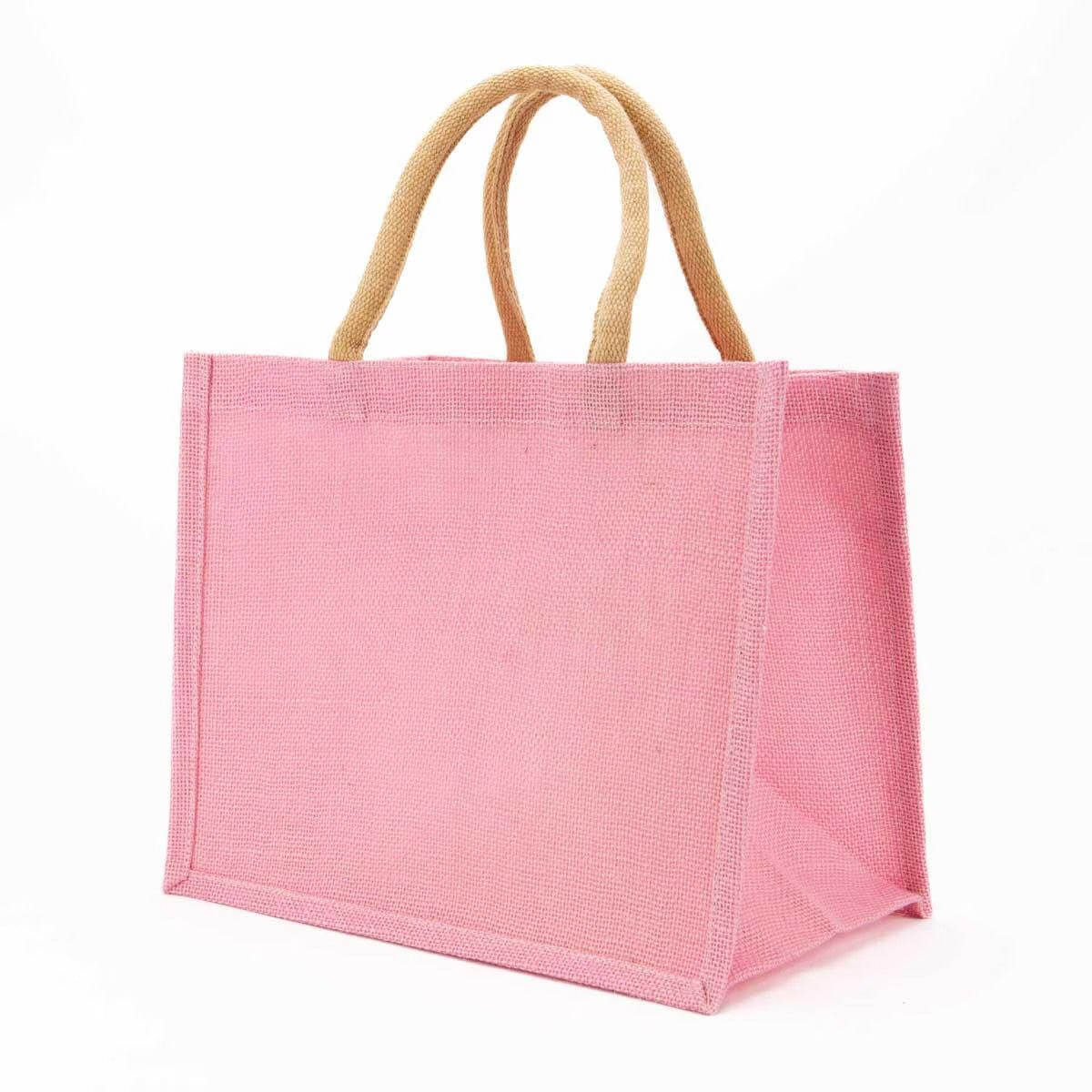 Large pink jute gift tote bag with beige woven handles. Available in multiple sizes. Ideal for monogramming or gifting.