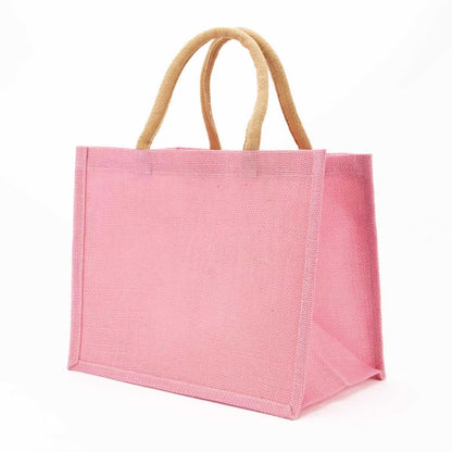Large pink jute gift tote bag with beige woven handles. Available in multiple sizes. Ideal for monogramming or gifting.