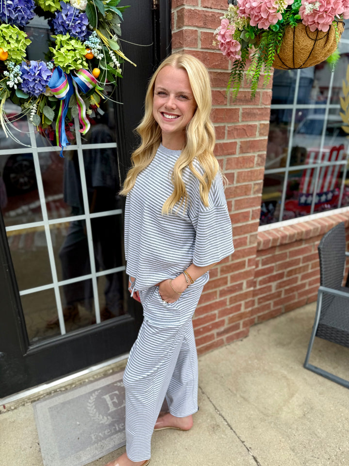 Striped Knit Top and Pants Set in available sizes XS–XL. Matching set features horizontal stripes, relaxed fit.
