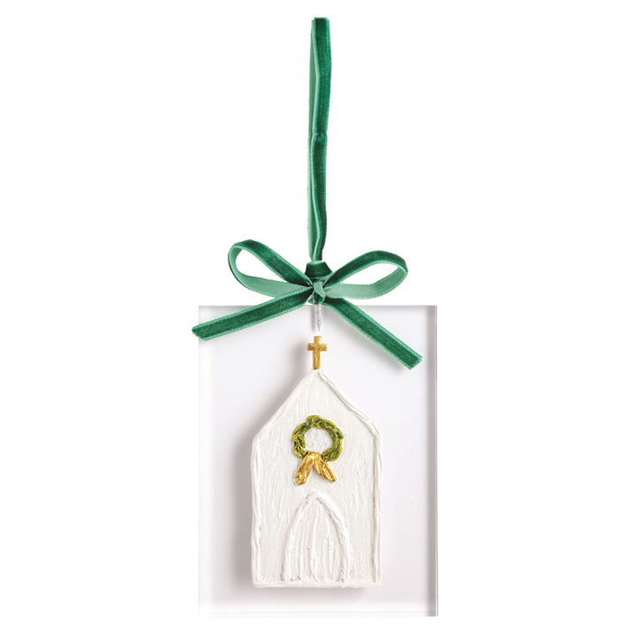 Handcrafted rectangular acrylic ornament with white church relief, gold cross, wreath, and green velvet ribbon.