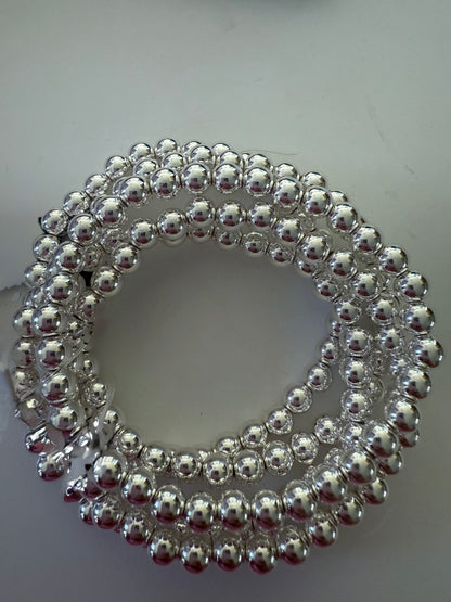 Beaded Stretch Bracelet with shiny silver beads in a coiled design. Available sizes: small, medium, large.