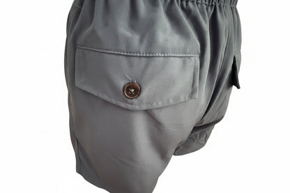 Men’s Khaki Drawstring Shorts with buttoned flap side pocket, shiny fabric, visible stitching, elastic waistband. Sizes S-XXL.