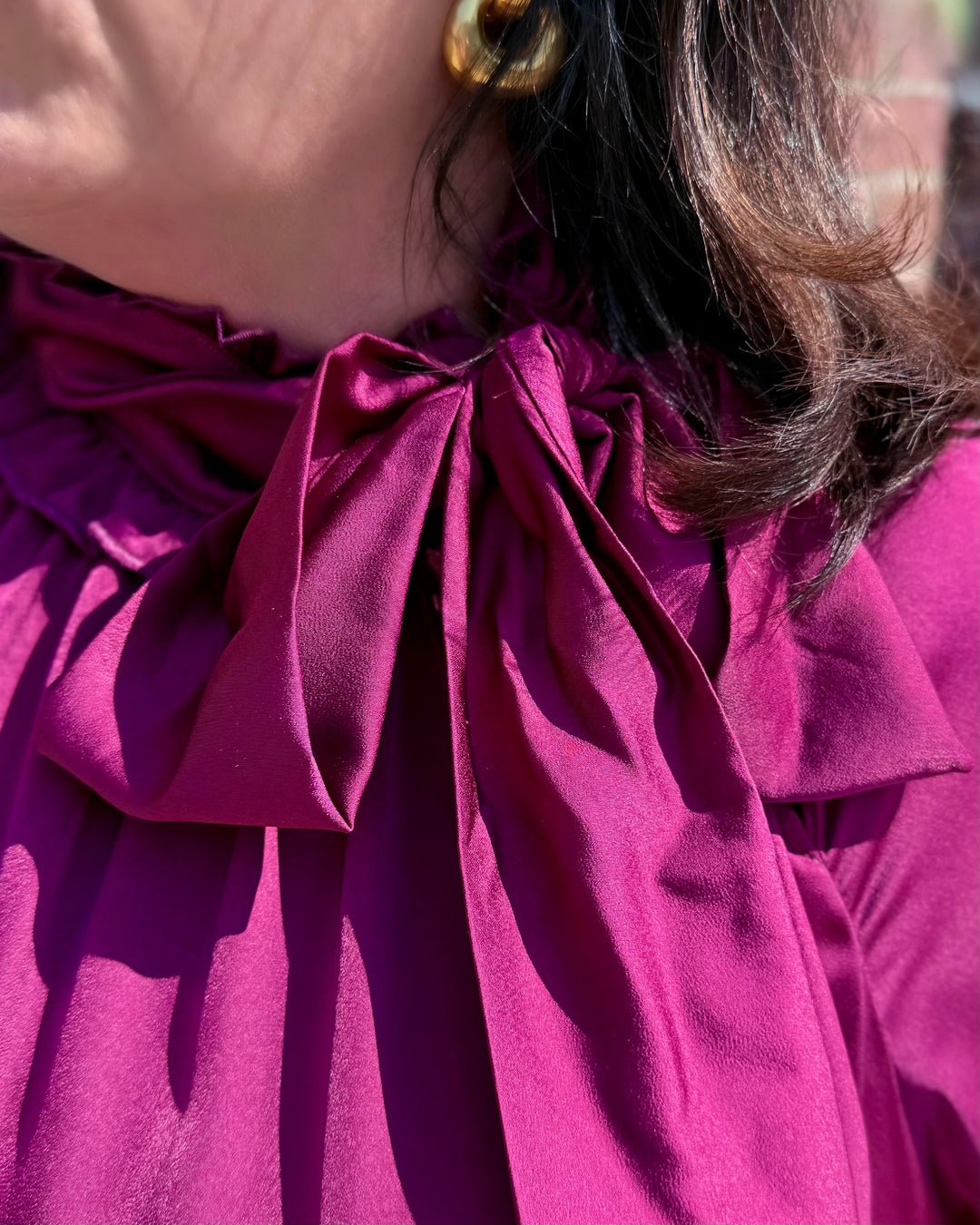 Plum Satin Tie Neck Dress with large collar bow. Available in sizes XS-XL.