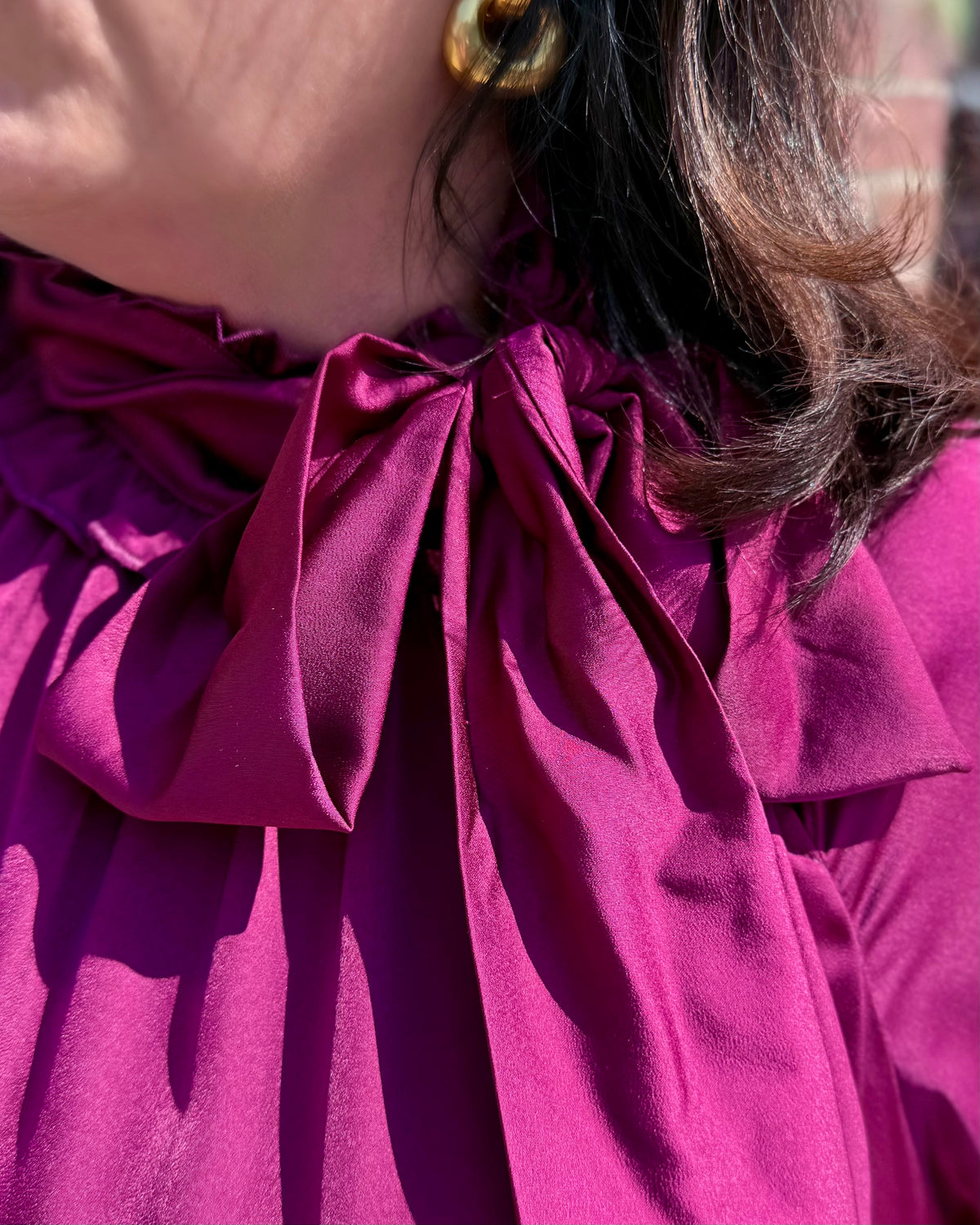 Plum Satin Tie Neck Dress with large collar bow. Available in sizes XS-XL.