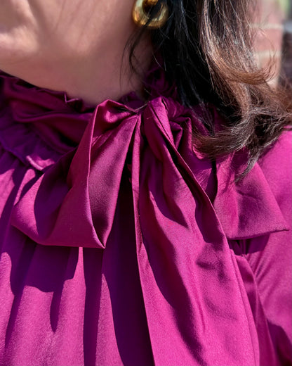 Plum Satin Tie Neck Dress with large collar bow. Available in sizes XS-XL.