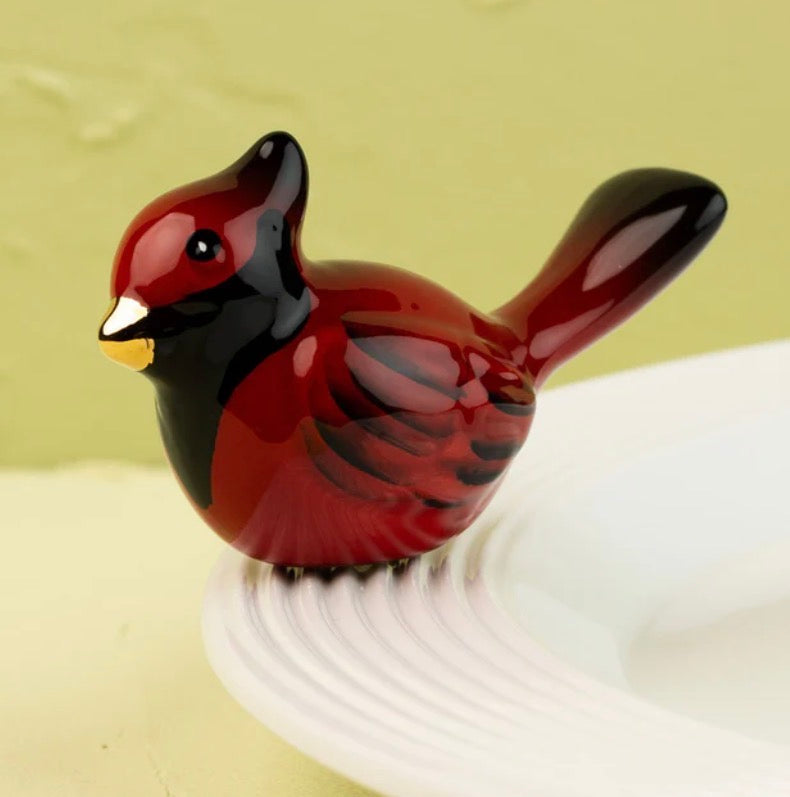 Glossy ceramic red cardinal figurine with black and gold accents from the Nora Fleming Minis collection. Sizes available: mini.