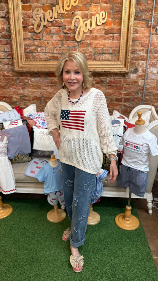 Oversized American Flag Sweater, available in S-XL. Features bold flag print and relaxed fit.