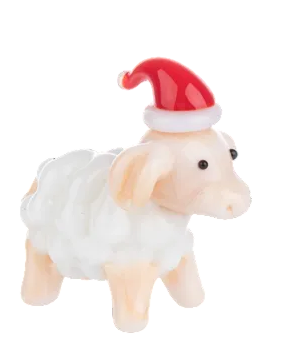 Small glass sheep figurine wearing a red Santa hat.