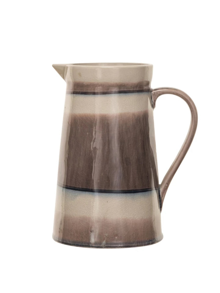 64 oz. stoneware pitcher with handle, small spout, beige and brown stripes, and reactive crackle glaze finish.