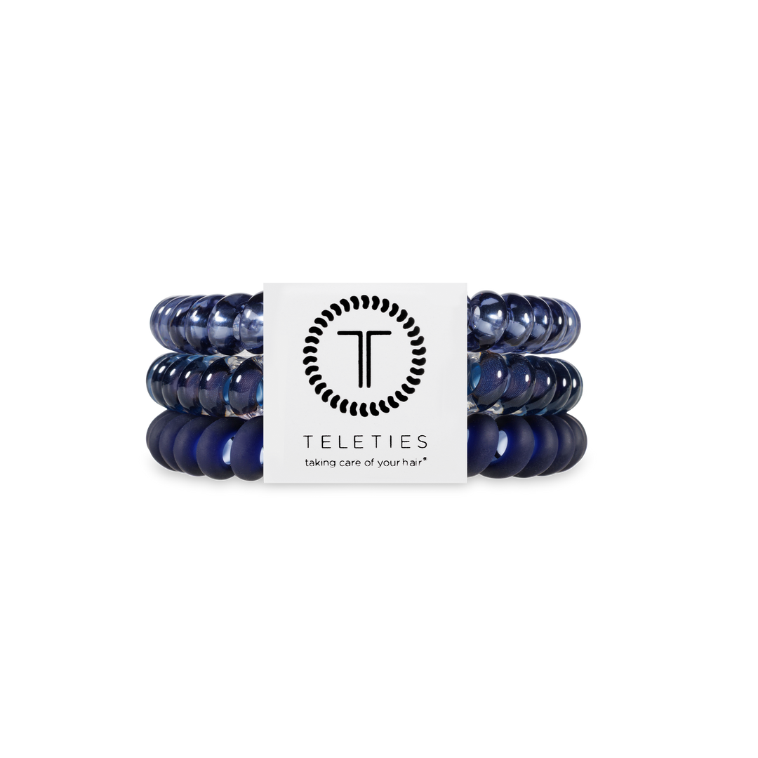Three small Nightfall Navy spiral hair coils with a white TELETIES label. Available size: Small. Secure, comfortable hold.