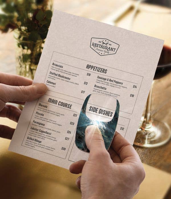 Optimum Optical The Hobbyist OptiCard LED Pocket Magnifier, available in 2x and 3x sizes, used to read the “SIDE DISHES” section of a restaurant menu.
