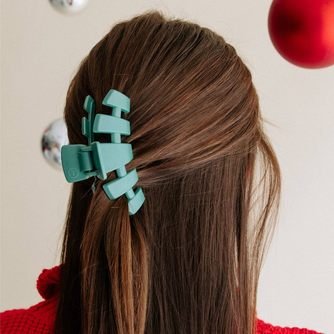The Classic Hair Clip | Fir Real: matte green claw clip with small "T" logo. Available in small and large sizes.