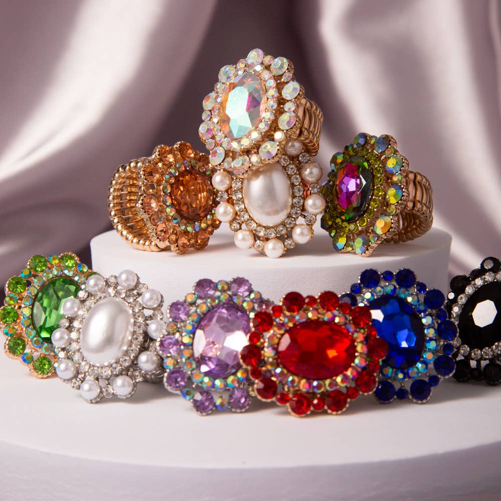 Oval Crystal Sunburst Double Halo Stretch Ring with ornate, colorful gemstones. Available sizes: S, M, L.