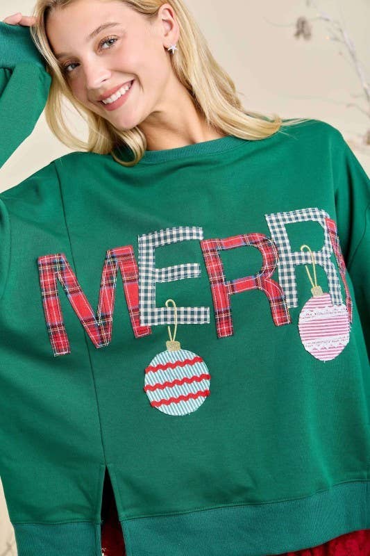 Merry With Ornament Patchwork Oversized Long Sleeve Top in hunter green, features “MERRY” in plaid patterns with two Christmas ornaments hanging from the letters. Available in sizes S-XXL.
