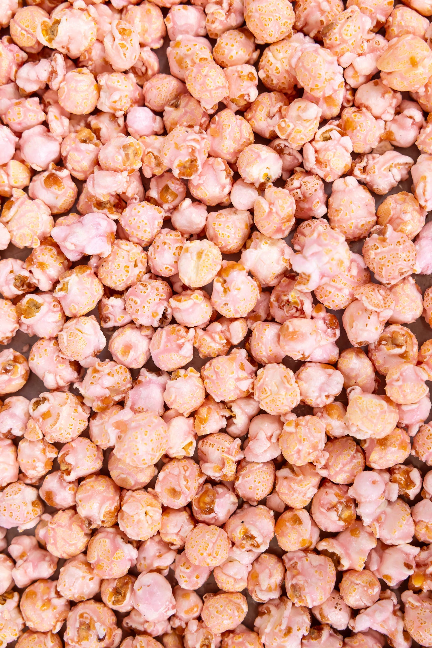 Glossy pink-coated Cotton Candy Popcorn, limited-edition, available in small and large sizes.
