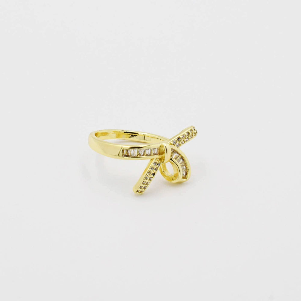 Gold-plated crisscross ring with clear pave stones; available in sizes 6, 7, and 8.