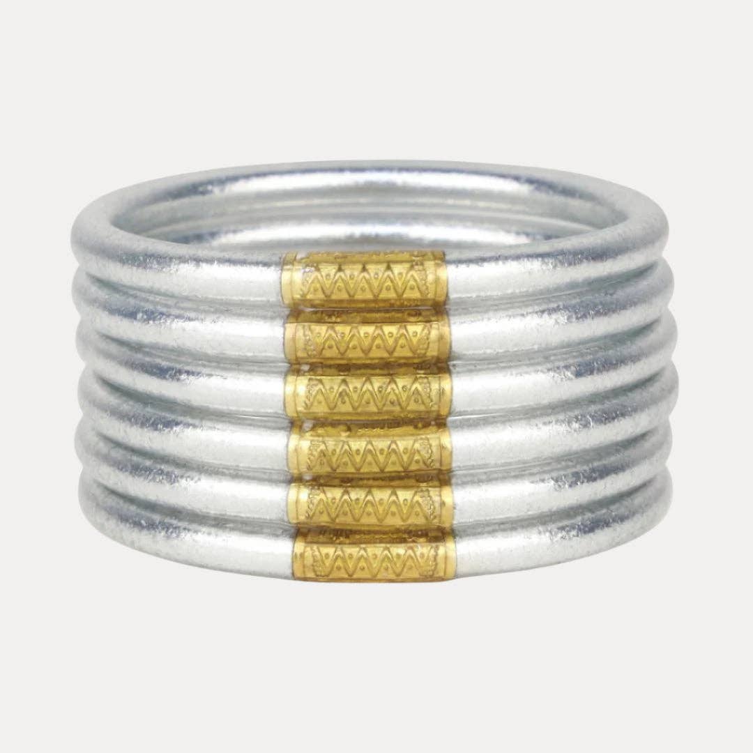Six silver bangles with gold-accented zigzag patterns. Available in Small, Medium, Large, and Extra Large.
