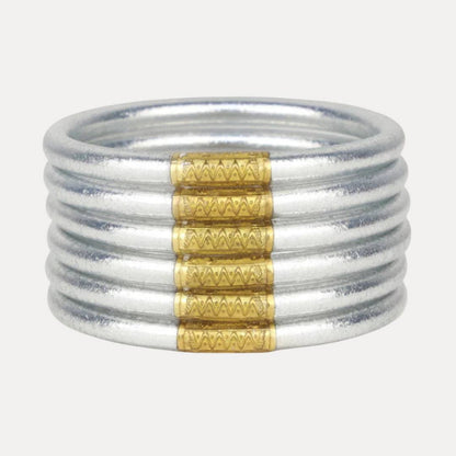 Six silver bangles with gold-accented zigzag patterns. Available in Small, Medium, Large, and Extra Large.