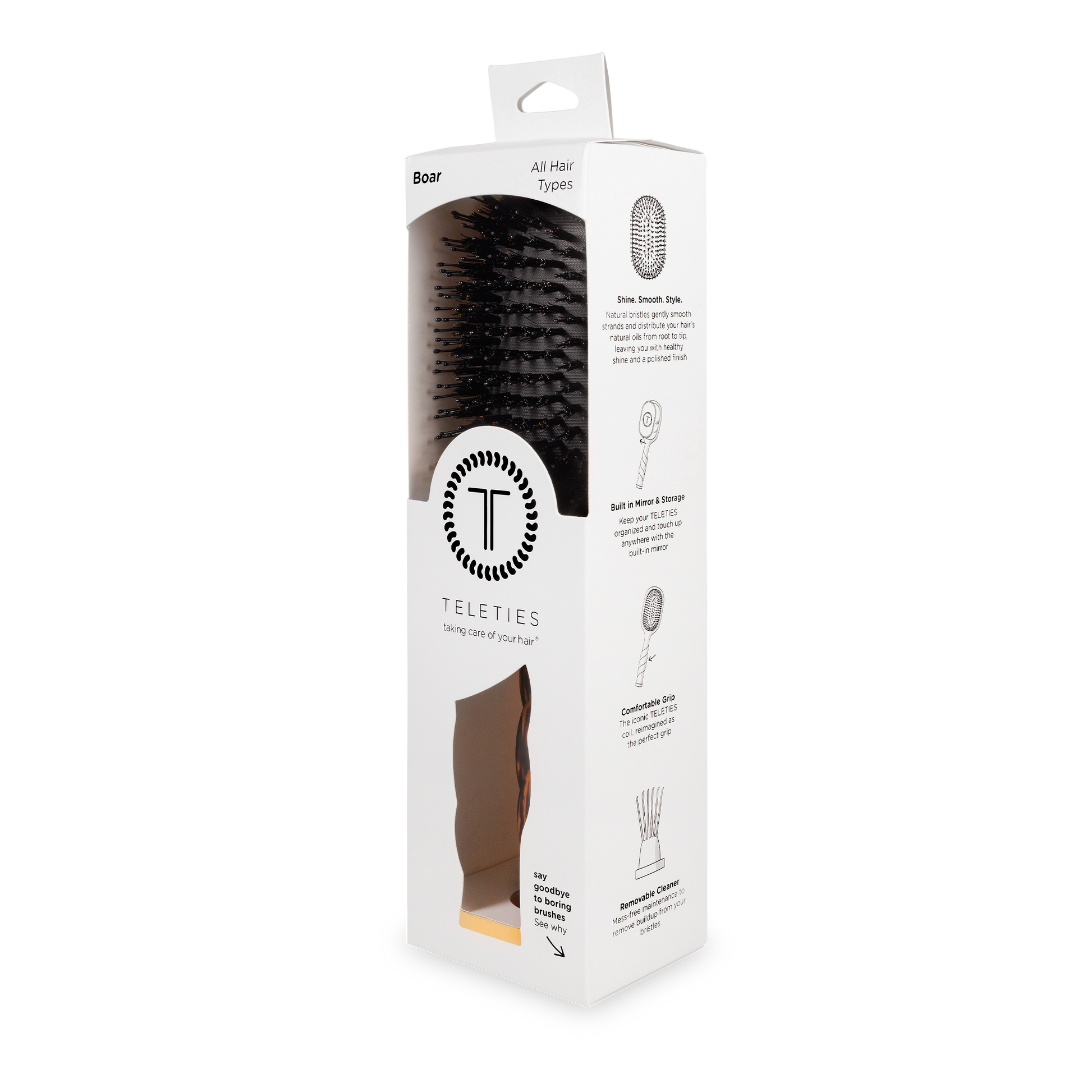White box with clear window displaying black boar bristle hair brush; sizes available: small, medium, large.