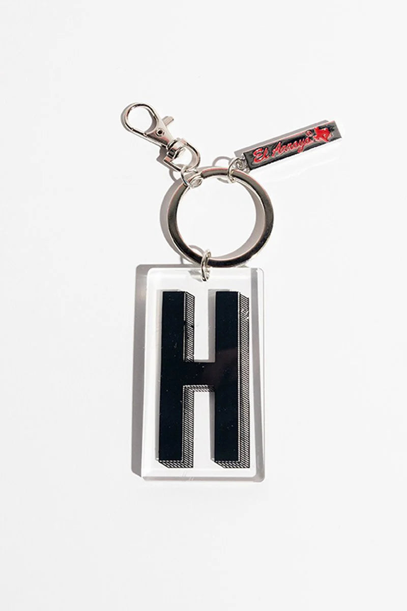 El Arroyo Marquee Letter Keychain, bold black "H" in clear frame, metal ring, tag with red text and rose. Available in 2" size.