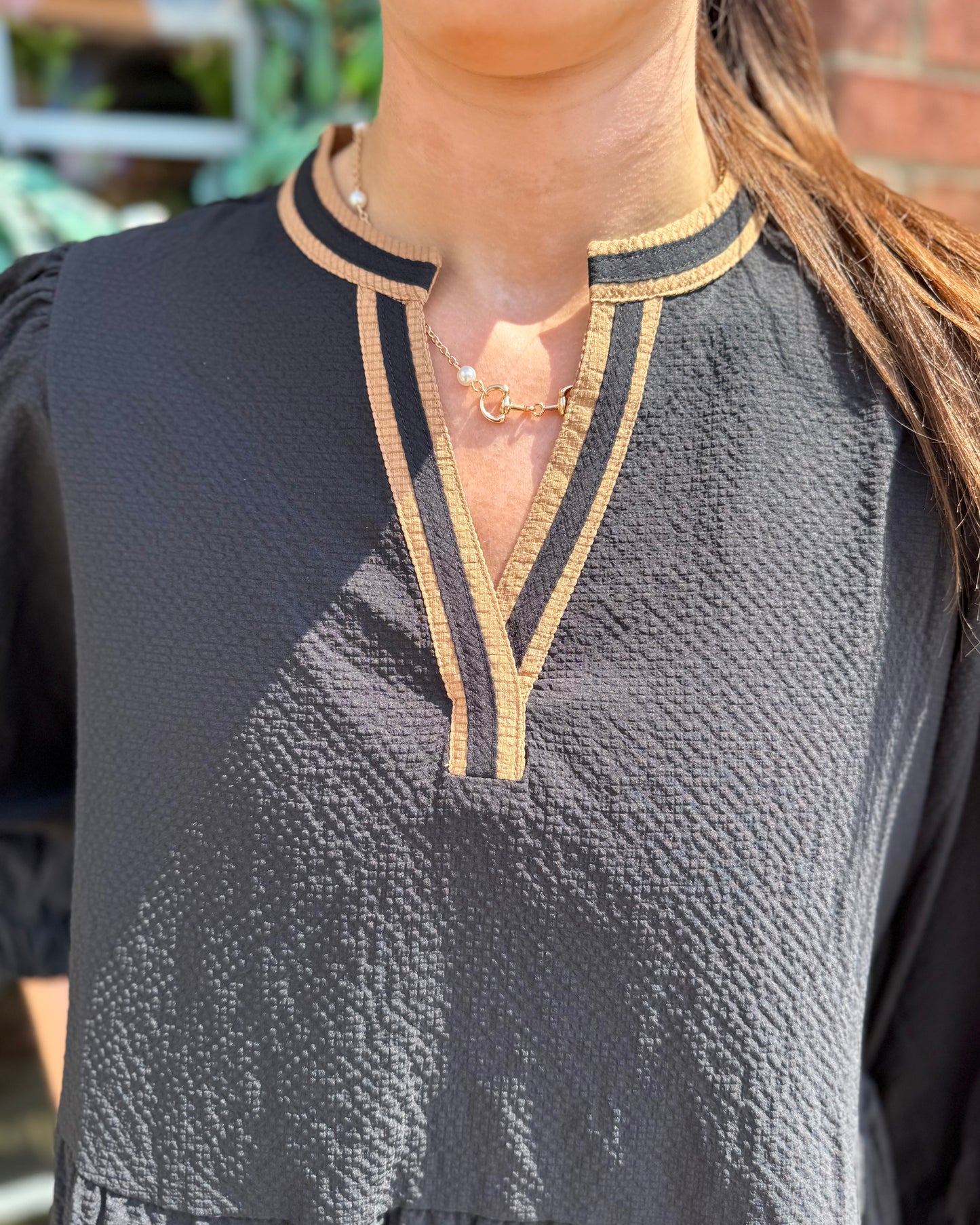 Cooper Dress | Black + Tan: textured black fabric with tan trim on collar and V-neckline. Available in sizes XS-XL.
