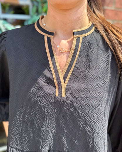 Cooper Dress | Black + Tan: textured black fabric with tan trim on collar and V-neckline. Available in sizes XS-XL.