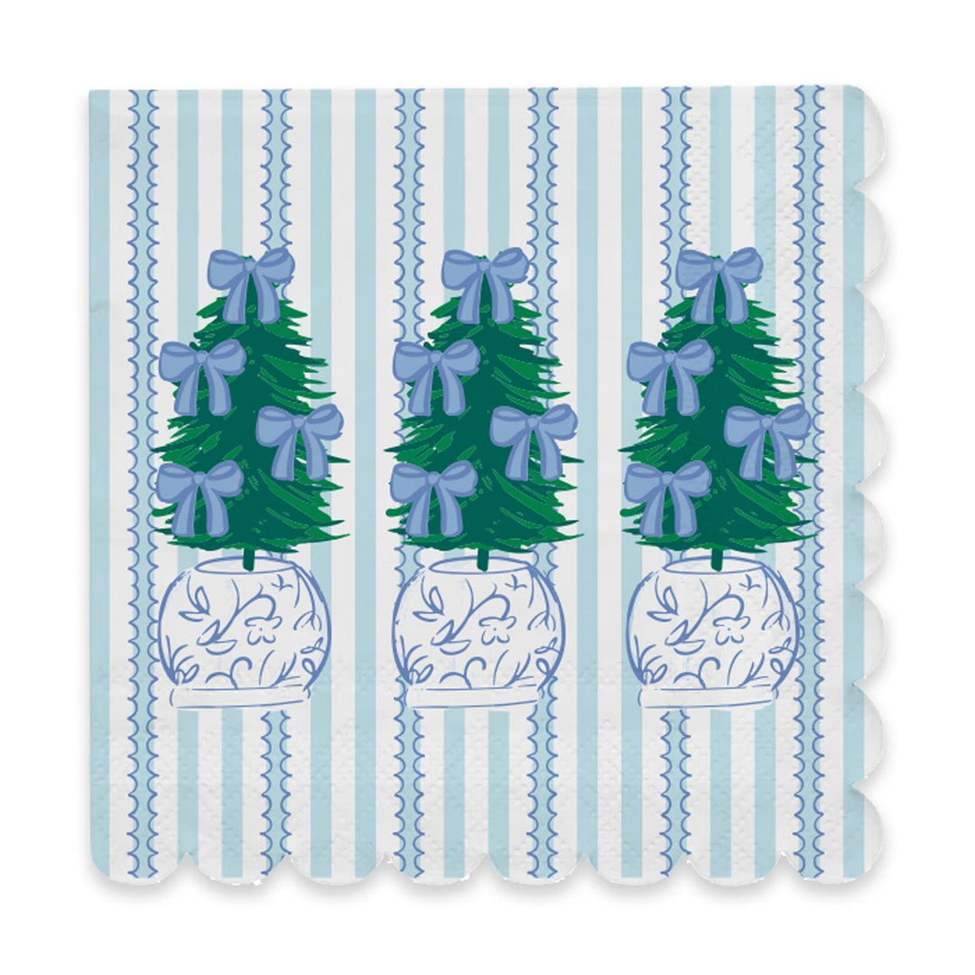 Square holiday cocktail napkins with scalloped edges, light blue vertical stripes, and a repeating potted Christmas tree print.