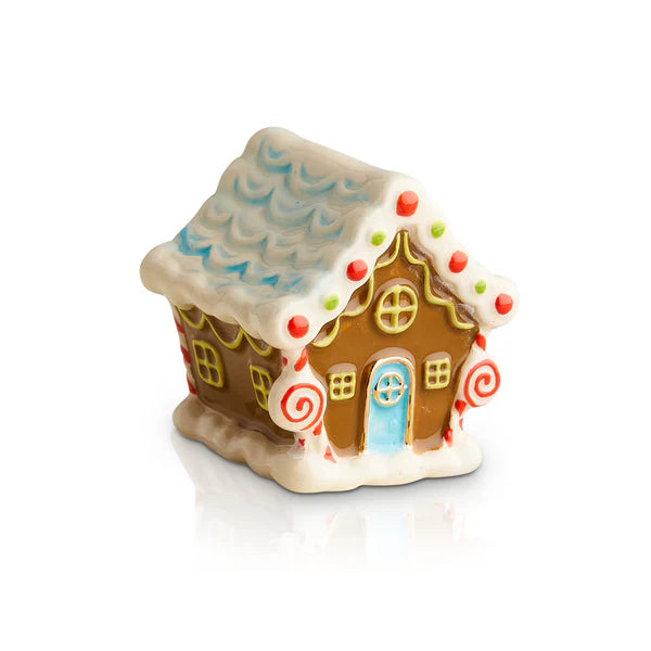 Ceramic gingerbread house with white icing, red and green accents, blue door, scalloped roof. Available in mini size.