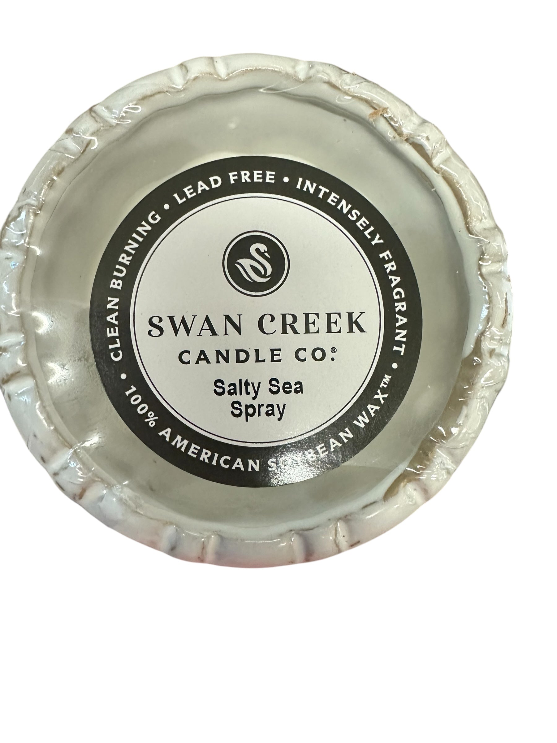 Small round white "Salty Sea Spray" soy candle by Swan Creek; clean burning, lead free, available in small fluted pot size.