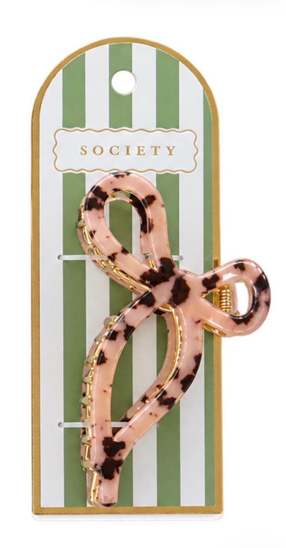 Pink and brown tortoiseshell metal bow claw clip; available in small and large sizes.