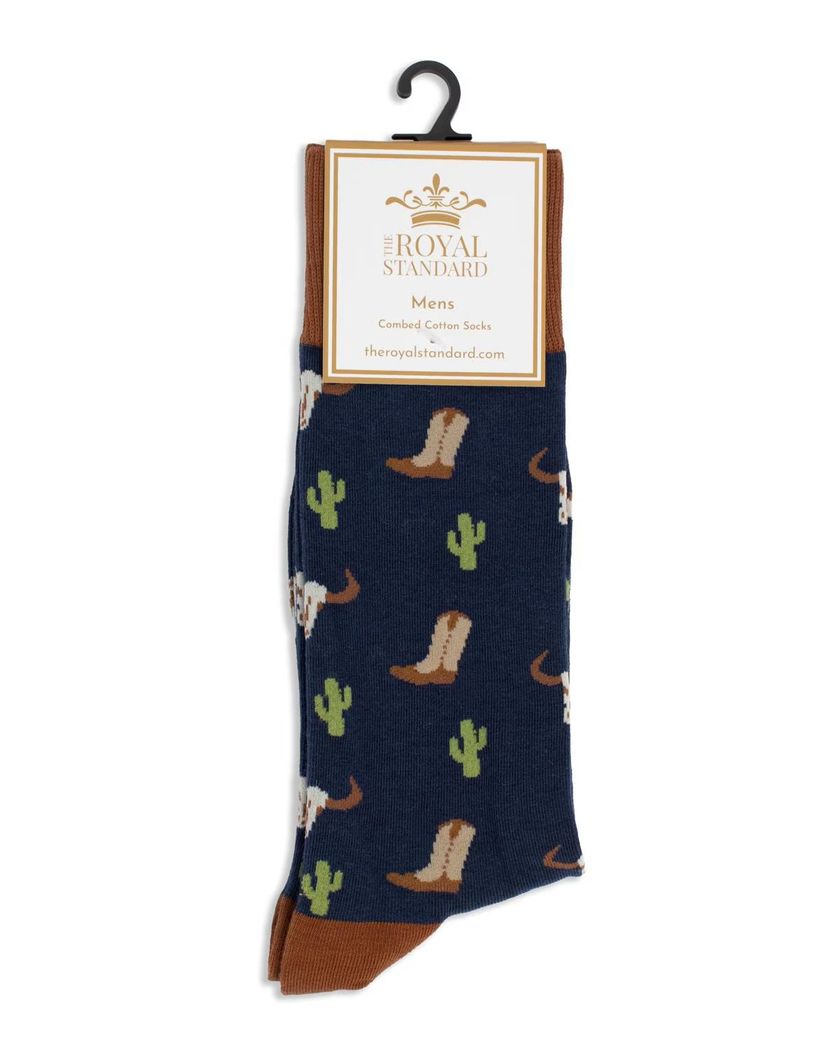 Men’s Wild West Socks: navy blue with brown heel and toe, Western motif of cowboy boots, longhorn skulls, and green cacti. Label: “The Royal Standard.” Available in men’s sizes.