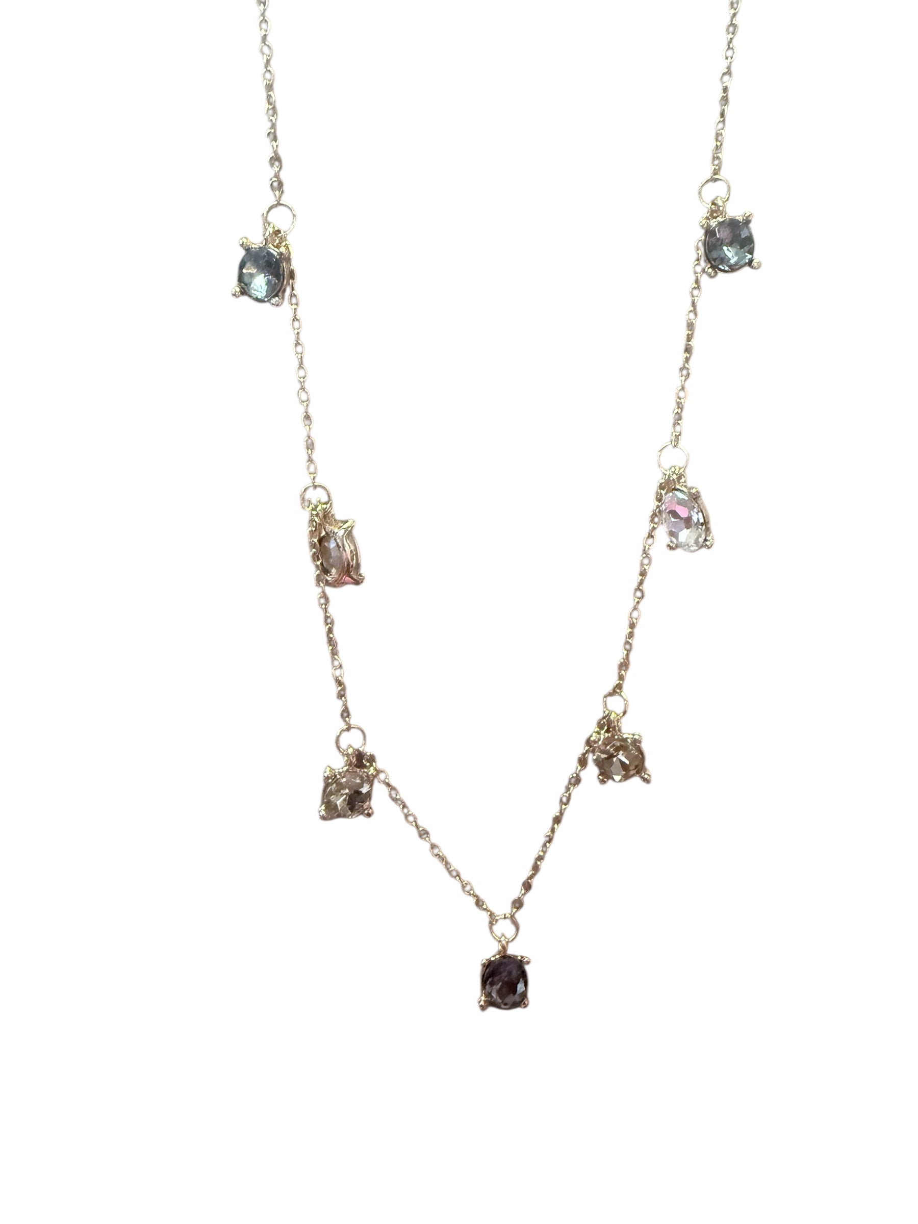 Delicate gold adjustable chain with seven small, irregular black diamond pendants. Available in 16", 18", and 20" lengths.