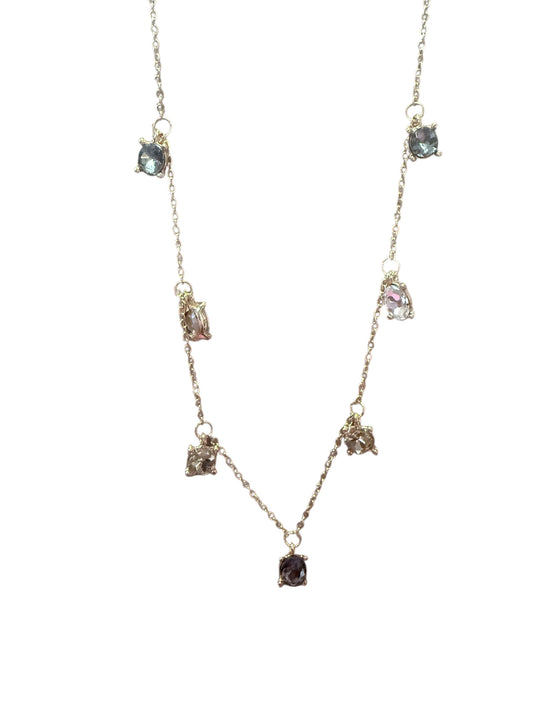 Delicate gold adjustable chain with seven small, irregular black diamond pendants. Available in 16", 18", and 20" lengths.