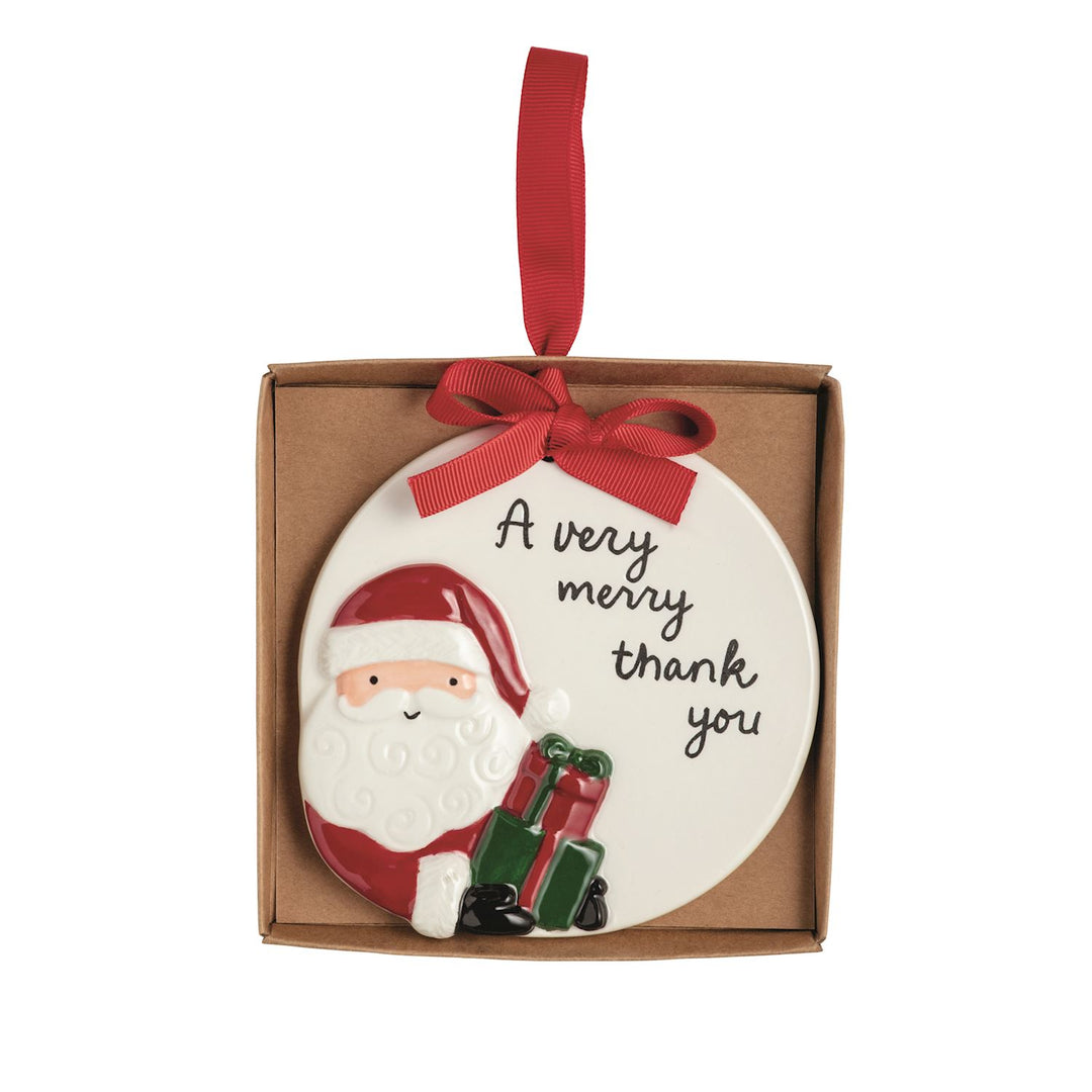 Round white ceramic Thank You Ornament featuring Santa with gifts and “A very merry thank you” text, packaged in a gift box with a red ribbon.