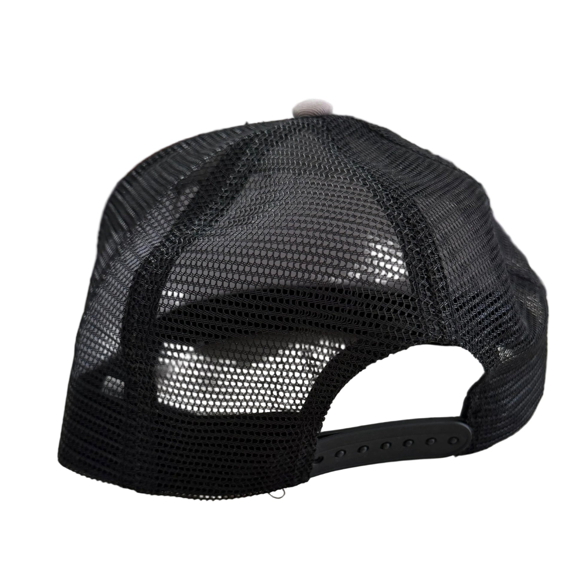 Black mesh trucker hat with “M” logo, adjustable snapback closure. Available in one size fits most.