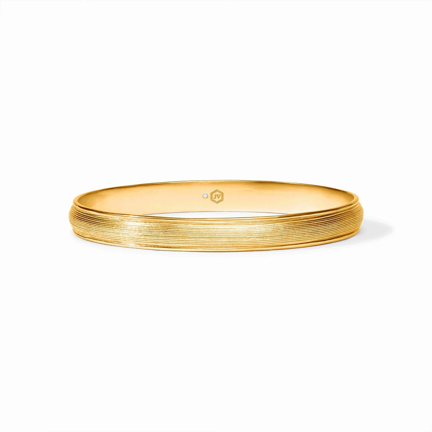 The Cobblestone Stacking Bangle has a textured 24K gold plate with a subtle ridged design on the outer surface. Available sizes: small, medium, large.