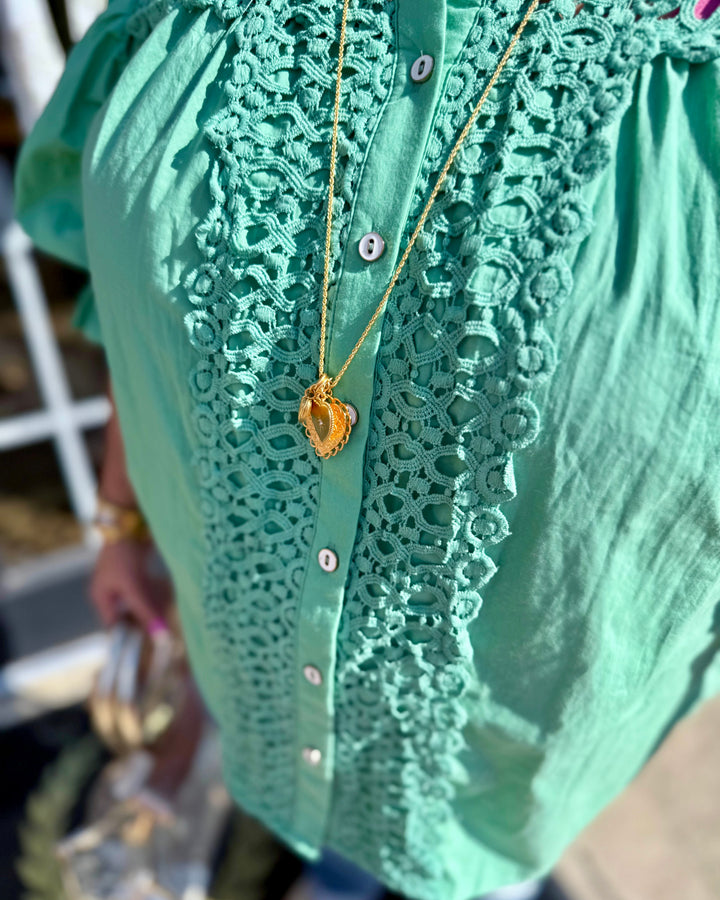 Mint Button Down Blouse: green cotton, lace details, white buttons, balloon sleeves. Available in sizes XS–XL.