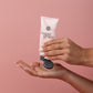 Sweet Grace Hand Cream being dispensed from a pink tube; available in 1.65 oz and 3 oz sizes.