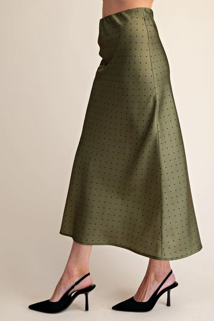 Polka Dot Satin Skirt: long, olive green with small black dots; available in sizes XS–XL.