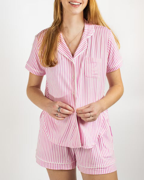 Pink and white pinstriped short-sleeve sleep shorts set with relaxed-fit button-down shirt and elastic-waistband shorts. Available in various sizes.