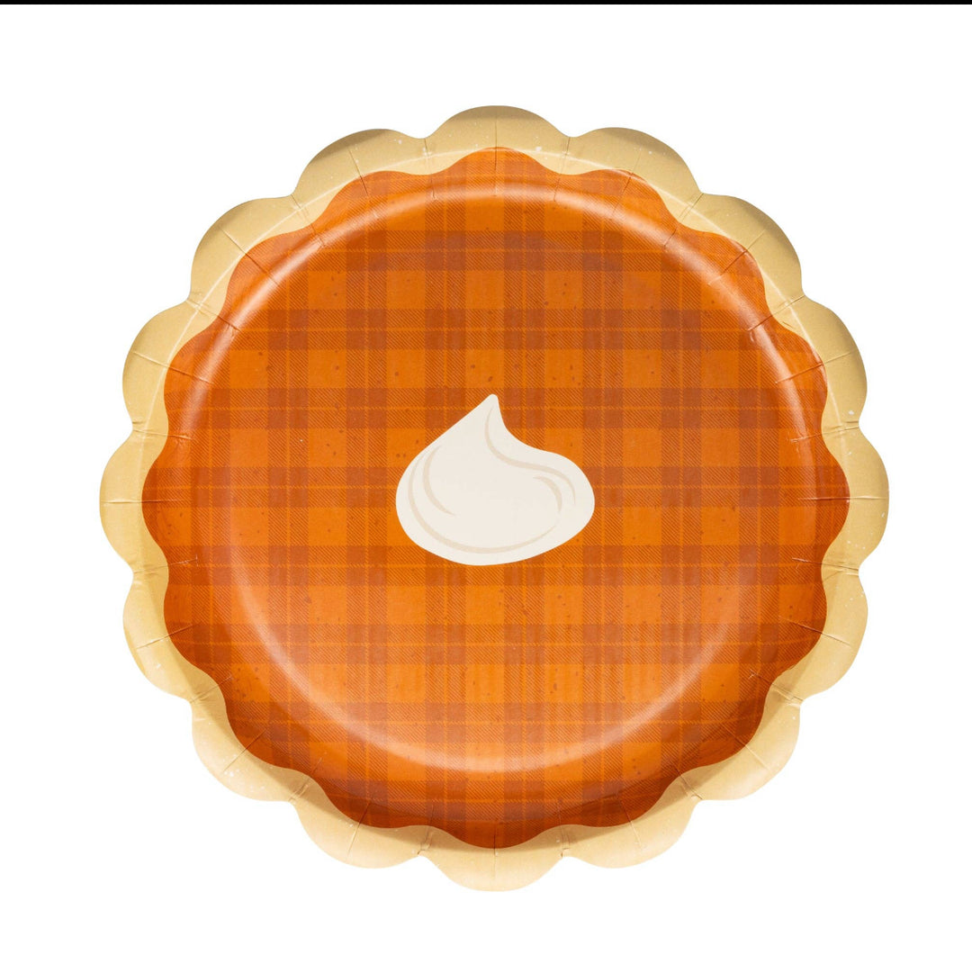 Round pumpkin pie paper plate with a scalloped tan edge, orange plaid center, and a dollop of white cream decoration; available in 7-inch and 9-inch sizes.