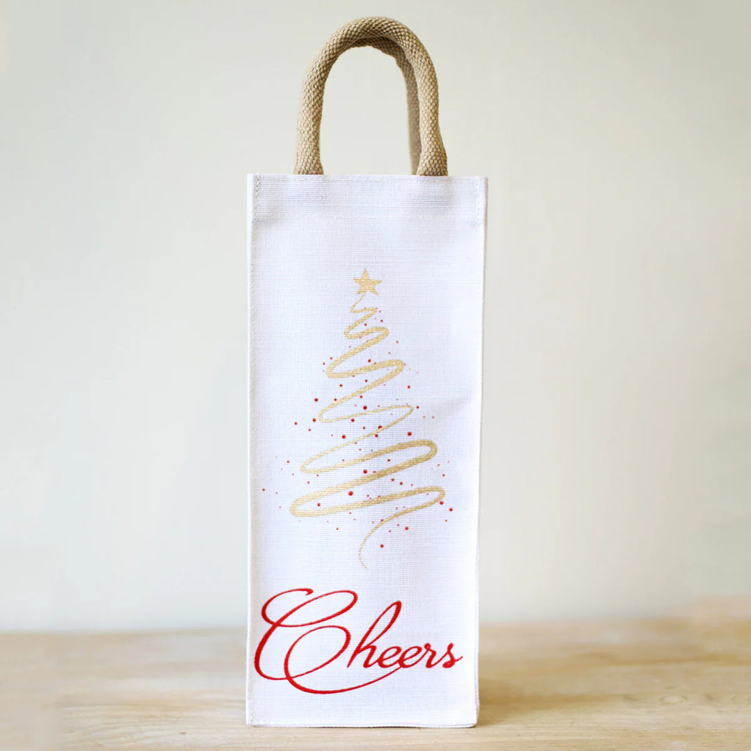 Cheers Tree Wine Bag featuring a tall white design with a gold spiral Christmas tree and “Cheers” in red script.