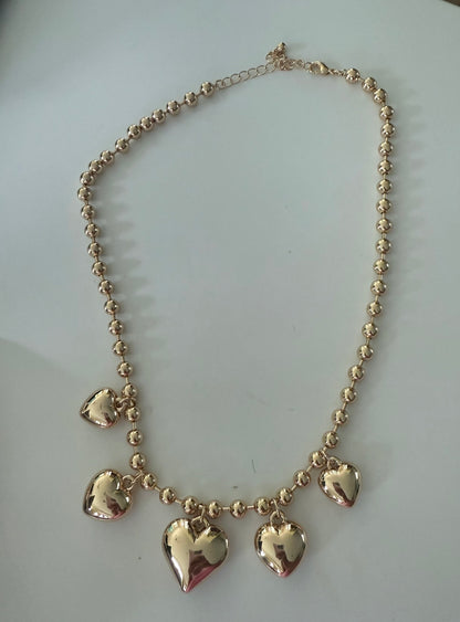 The Heart Ball 18k Gold/Silver Necklace with five heart pendants; available in multiple sizes.