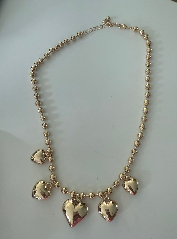 The Heart Ball 18k Gold/Silver Necklace with five heart pendants; available in multiple sizes.