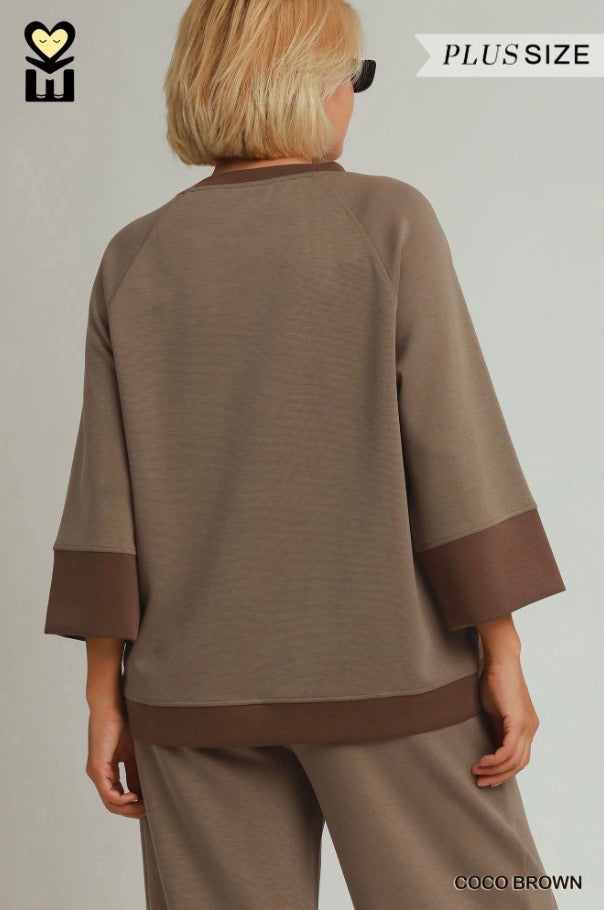 Relaxed-fit brown plus-size top with wide sleeves, darker brown cuffs and hem, paired with Coco Brown Color block Straight Pants in modal tencel. Available in plus sizes.