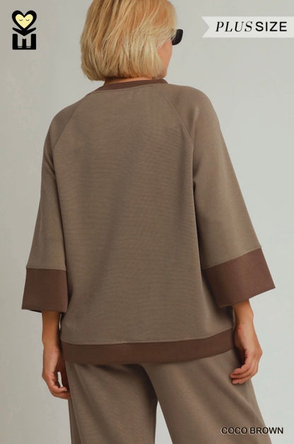Relaxed-fit brown plus-size top with wide sleeves, darker brown cuffs and hem, paired with Coco Brown Color block Straight Pants in modal tencel. Available in plus sizes.