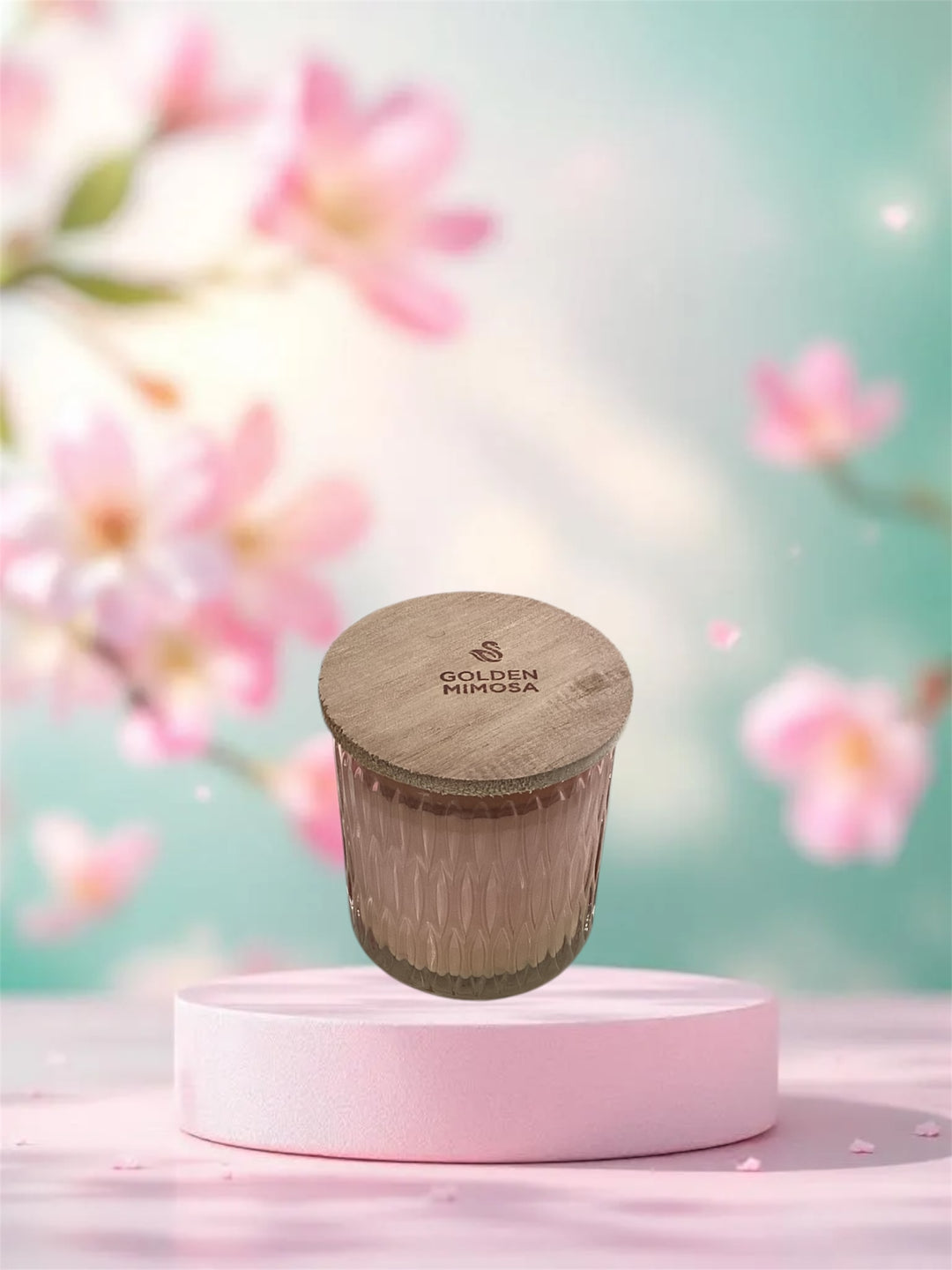 Golden Mimosa Cathedral Candle in a textured pink glass jar with a logo-branded wooden lid.