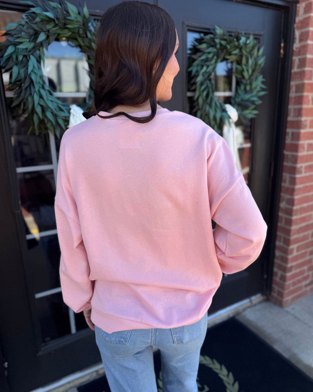 Back view, light pink Clara Wreath Sequin Sweatshirt crewneck. Sizes available.